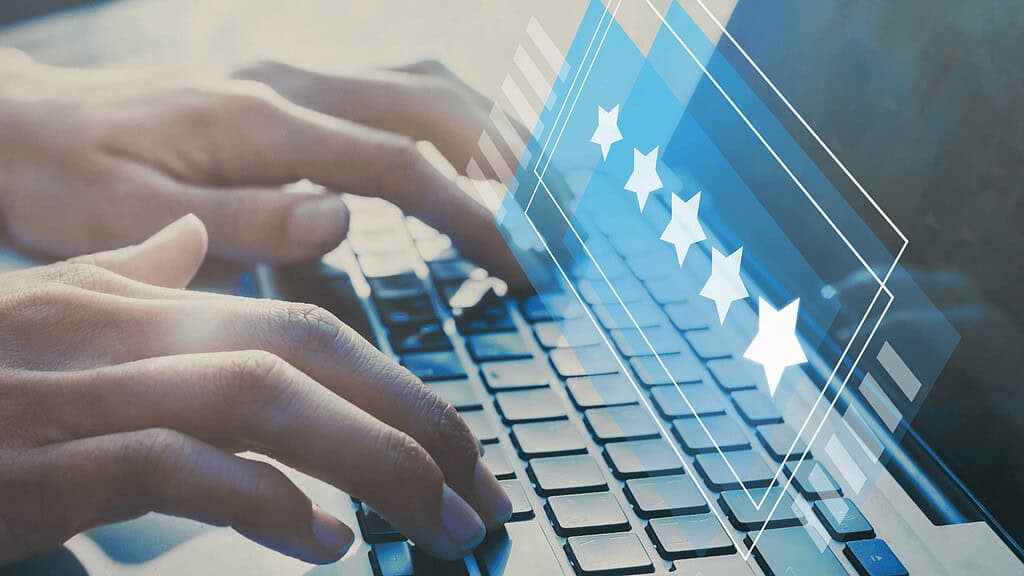 Keyboarding student working on a laptop, digital overlay of stars and geometric shapes highlighting computer science and IT training programs at MyComputerCareer.