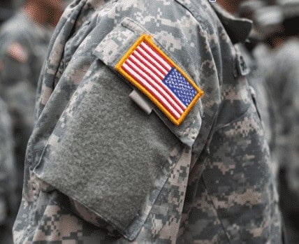 American flag patch on military uniform showcasing service and patriotism.