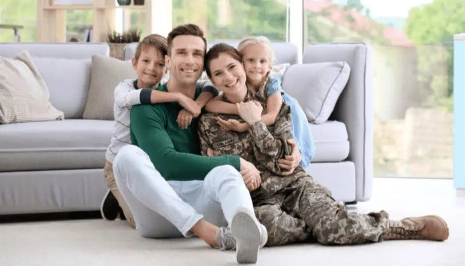 Family enjoying time together on couch, homeschooling or digital learning, happy family, modern living room, promoting IT and tech skills training at MyComputerCareer.