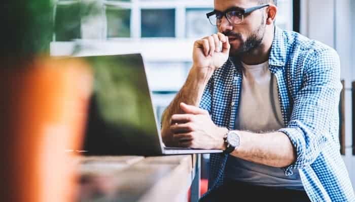 Dedicated IT student studying on a laptop at MyComputerCareer's modern learning facility.