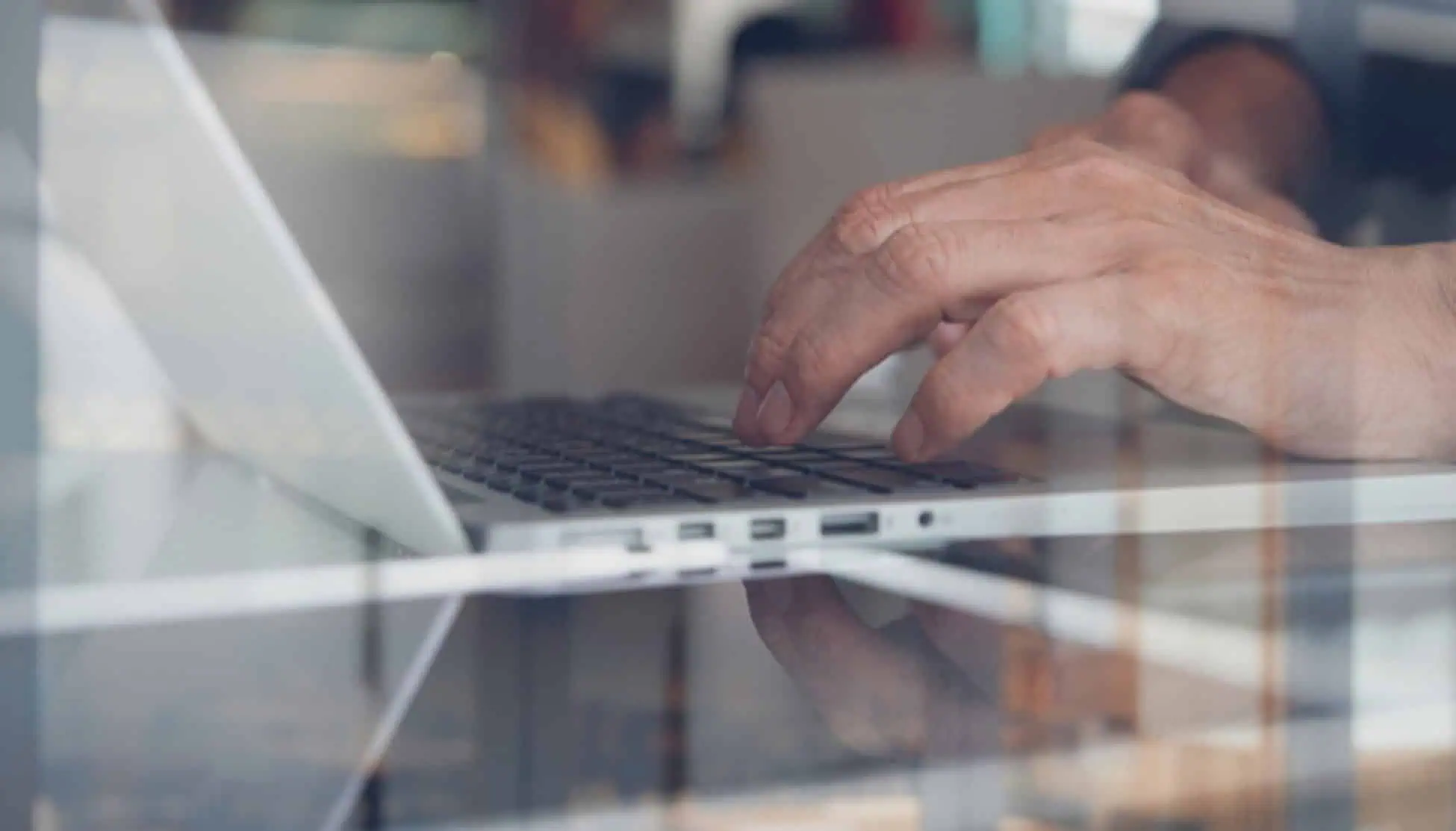 Hands typing on a laptop keyboard, representing online IT training programs at MyComputerCareer.