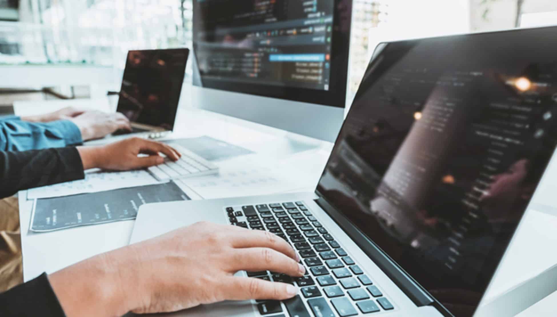 Laptop computers with coding and programming screens, students working on IT and computer science courses at MyComputerCareer.