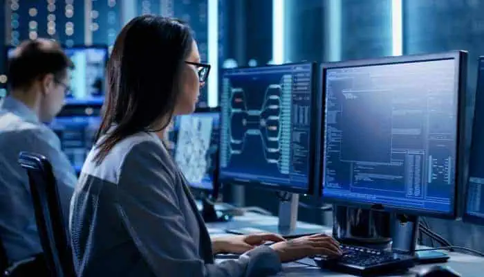 High-tech cybersecurity training at MyComputerCareer in a modern computer lab emphasizing IT skills development.