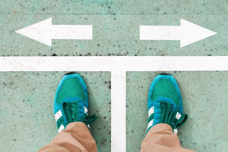 Directional sign with arrows for choosing career paths or training options at MyComputerCareer.