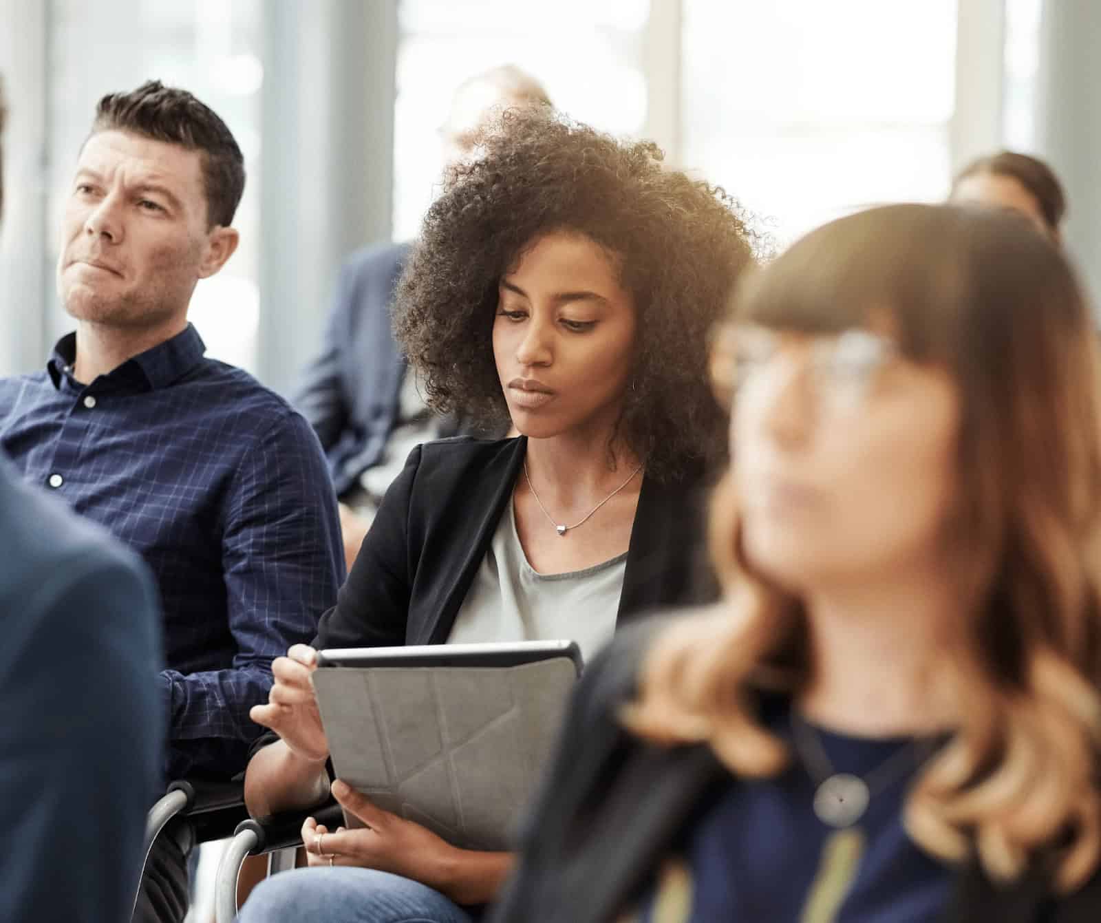 Career training in information technology at MyComputerCareer, students engaged in learning, note-taking, and professional development, fostering IT skills for career advancement.