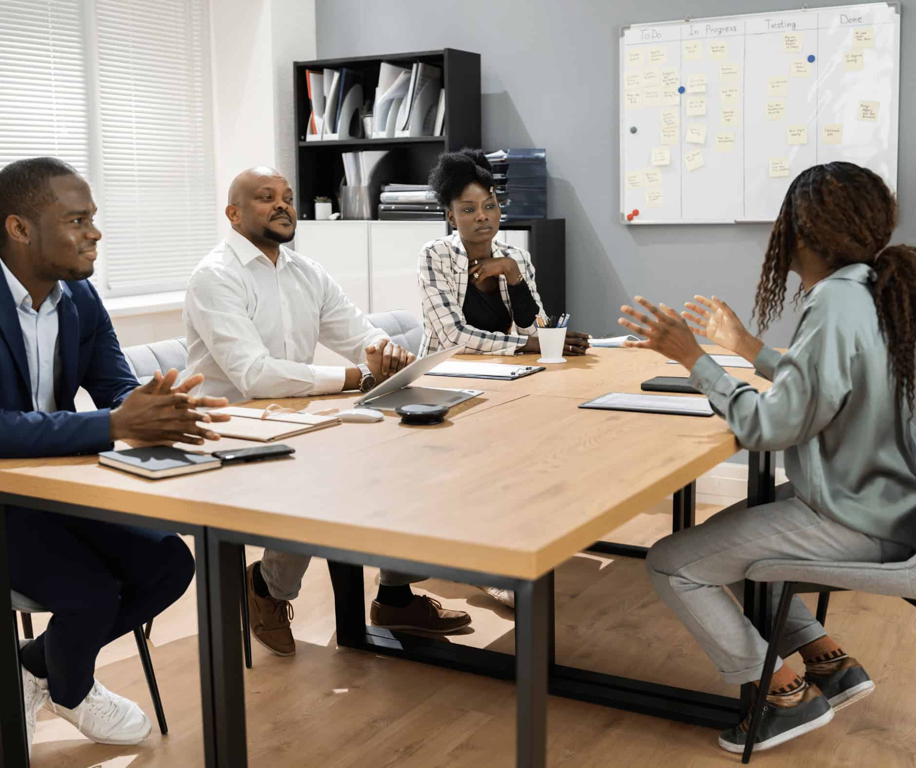 Flexible work environment at MyComputerCareer with diverse students and instructor discussing IT career training in a modern classroom.