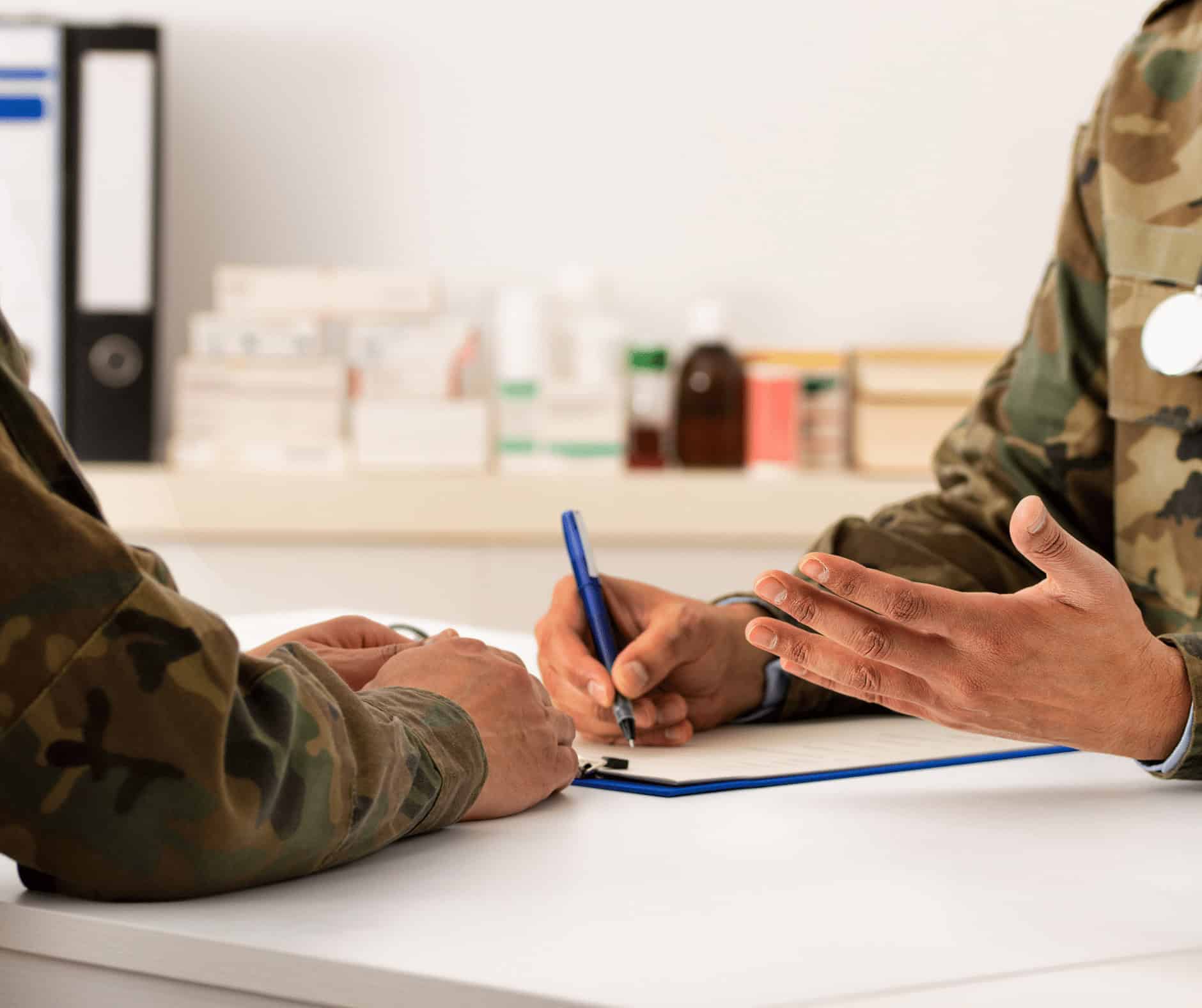 Active military personnel discussing career transition and educational programs at MyComputerCareer for tech skills training.