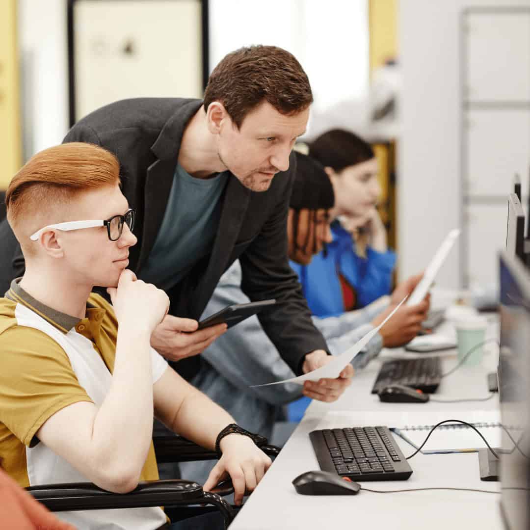 Detailed computer training classroom with students learning in a tech education program at MyComputerCareer.