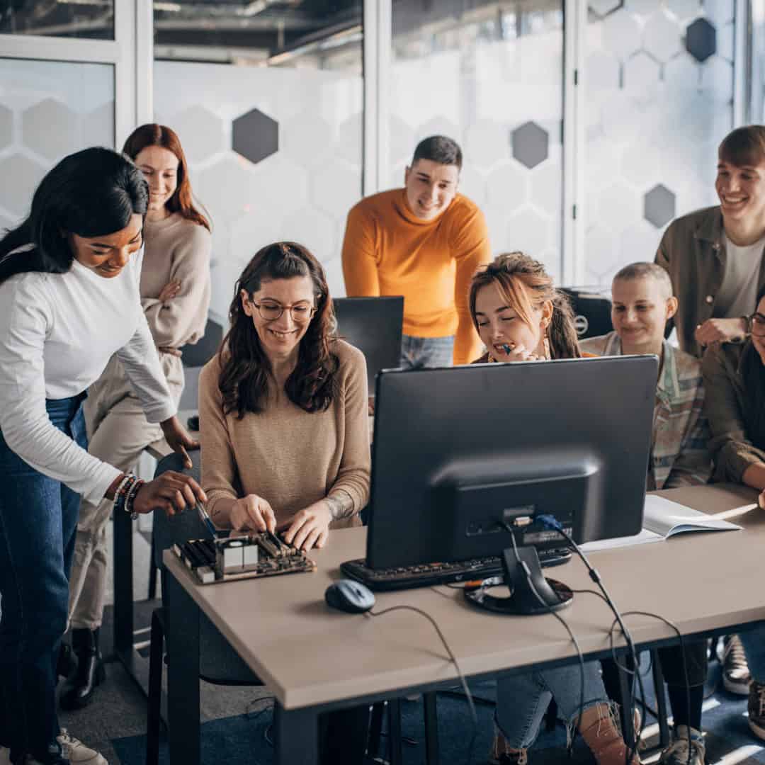 Laptop training in a collaborative tech classroom at MyComputerCareer. Students gain hands-on IT skills, preparing for successful tech careers through expert-led courses.
