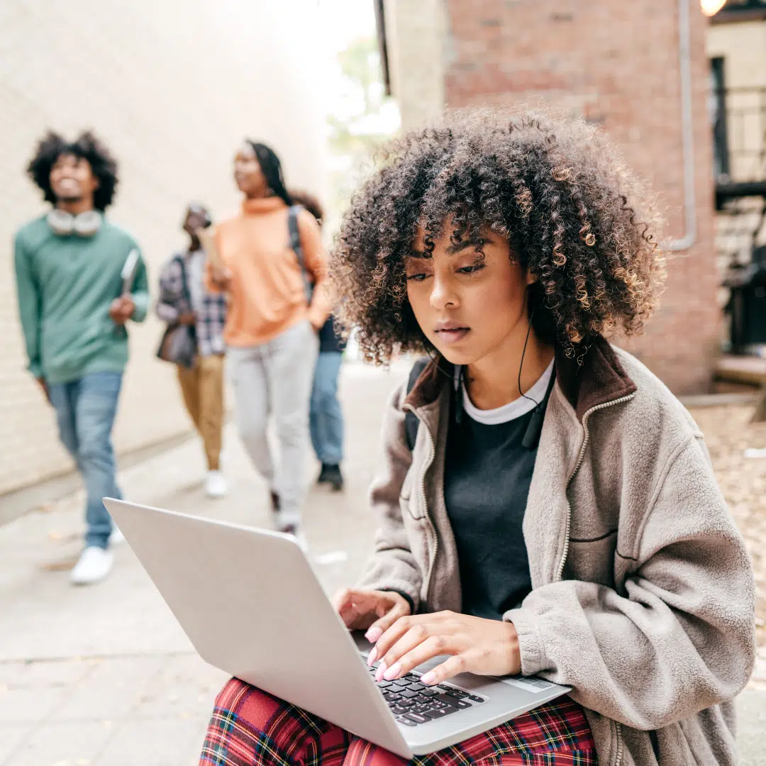 Laptop girl doing online learning for IT training or computer certification courses.