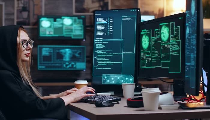 Computer programmer working on cybersecurity or IT training at MyComputerCareer, emphasizing tech education and IT career advancement in a modern learning environment.