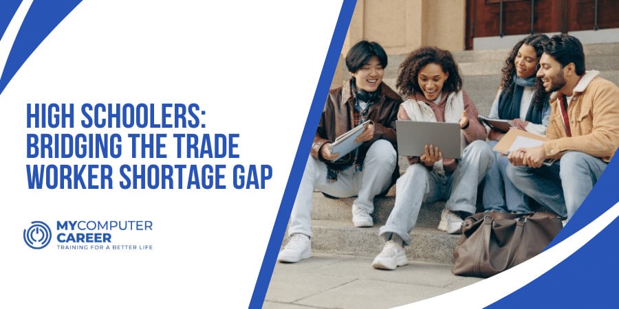 A diverse group of high schoolers in a tech class, preparing for skilled careers to address the trade worker shortage.