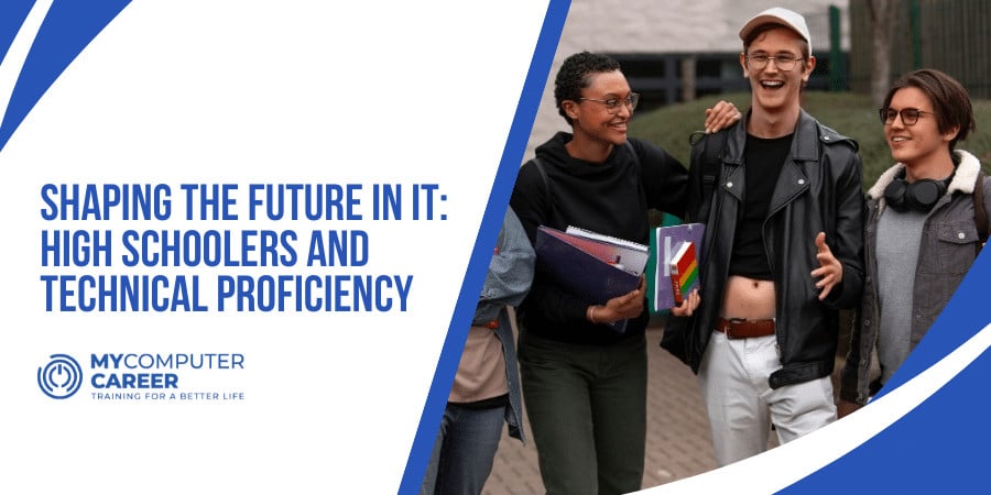 An instructor guides two students during IT training for high schoolers, helping them gain technical proficiency.