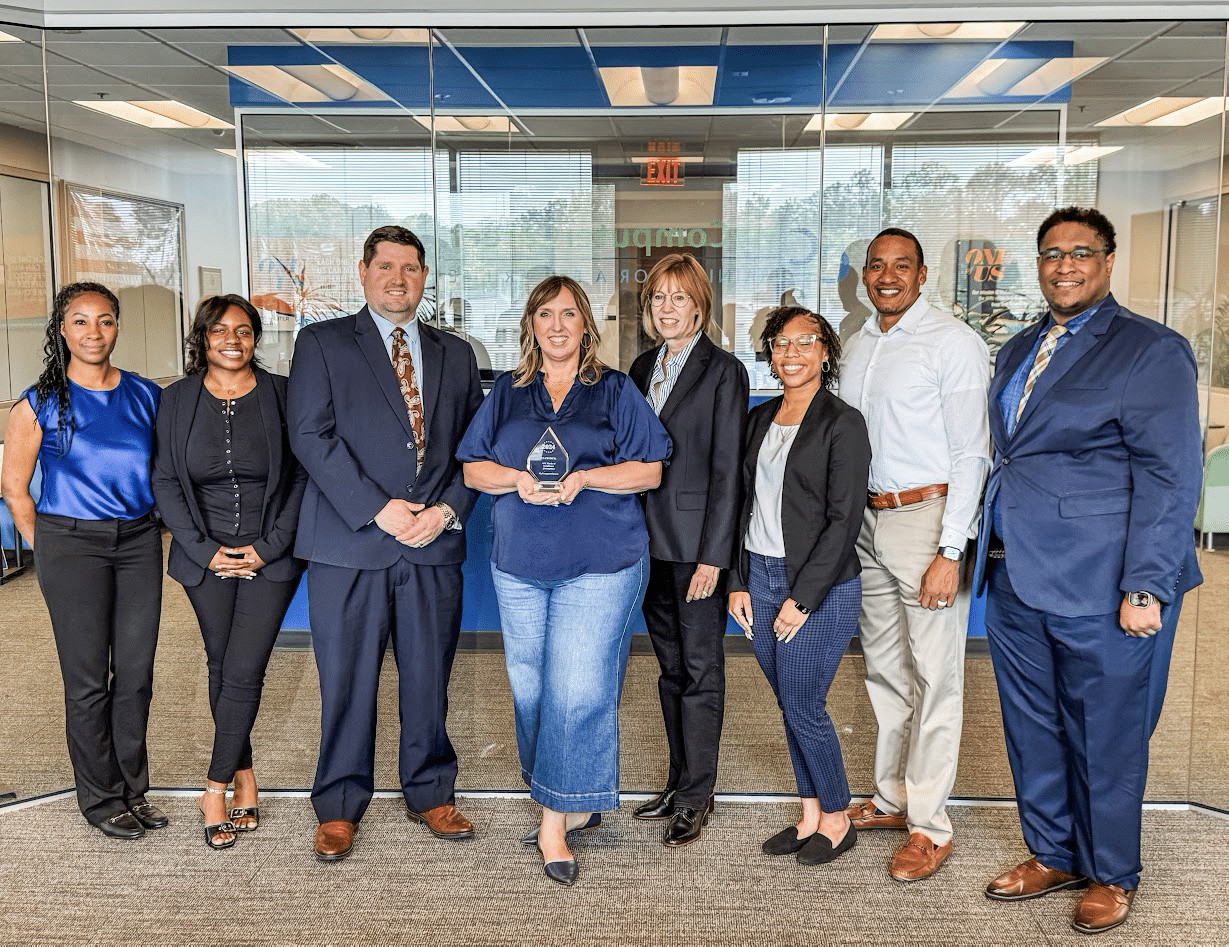 The MyComputerCareer team accepting their cybersecurity training award from the EC-Council for the fourth consecutive year.