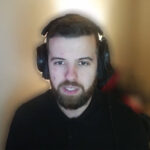 Man wearing headphones during online stream
