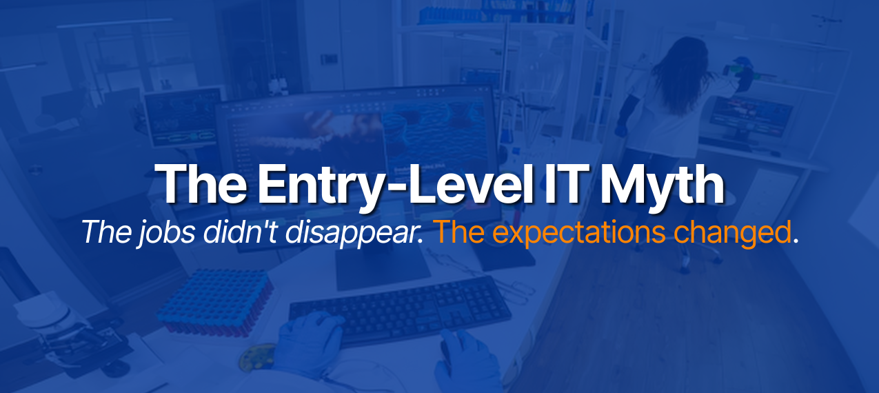 The Entry-Level IT Myth text over tech workspace