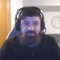 Bearded man wearing headset indoors
